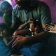 Mohana holds her niece while sitting with her family in their house in the village of Devanapattinam.